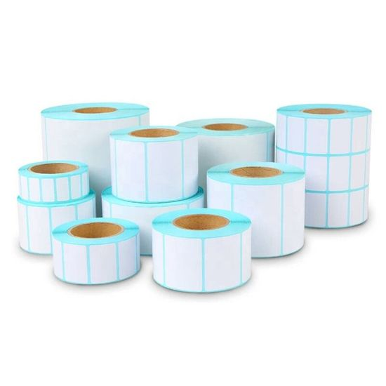 Multiple white label paper rolls stacked on white background