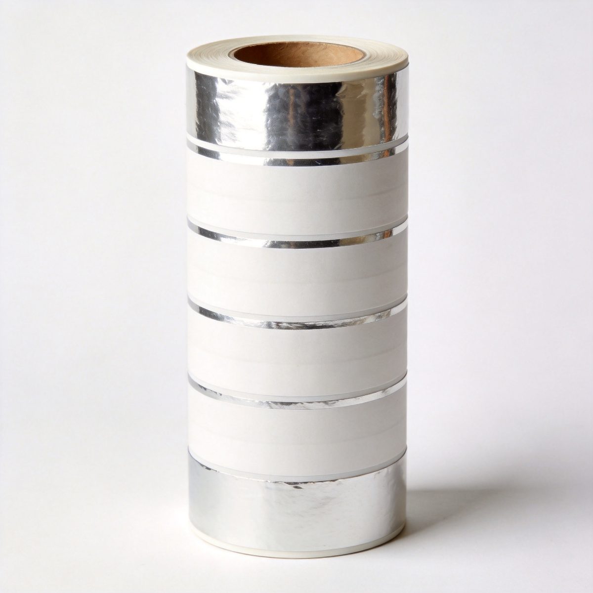 Product label rolls with metallic foil accents and barcodes